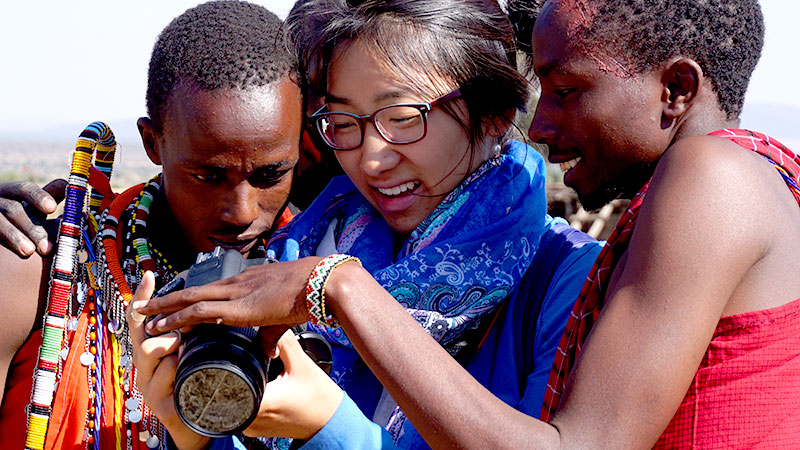 Taylor with Maasai warriors