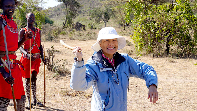 Taylor's mother takes instruction from Maasai warriors