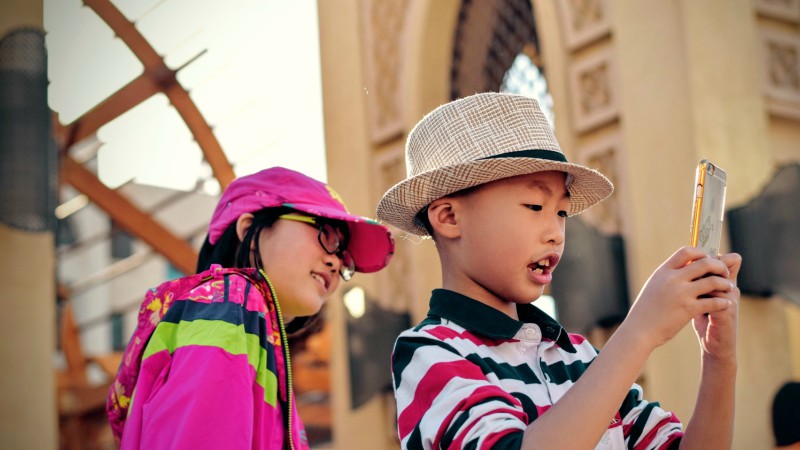 Kids taking photo on smartphone