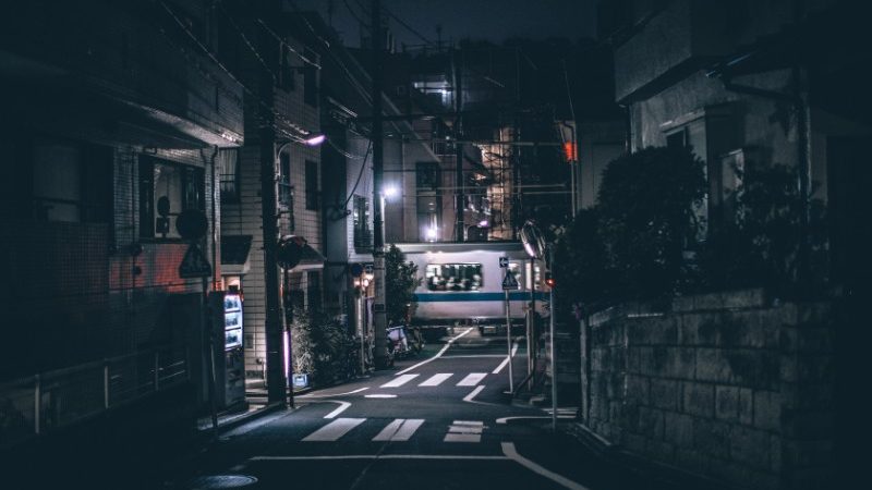 A train speeds through Tokyo.