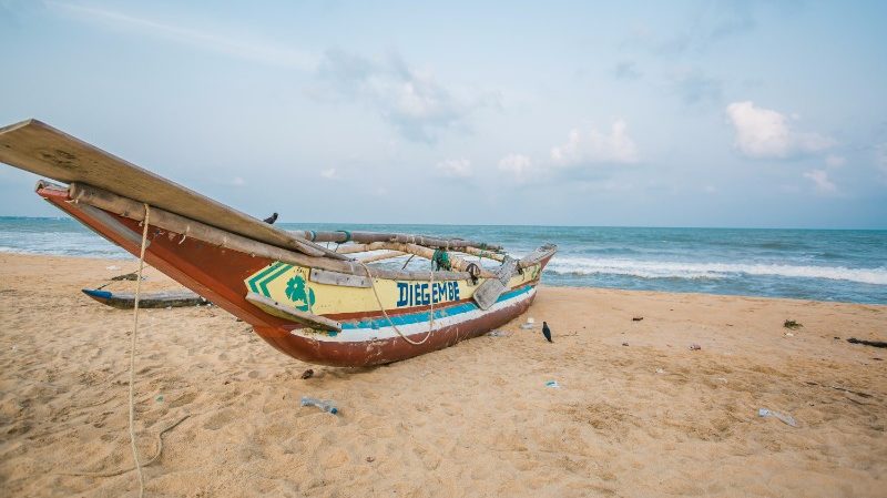 negombo beach and traditional boat
