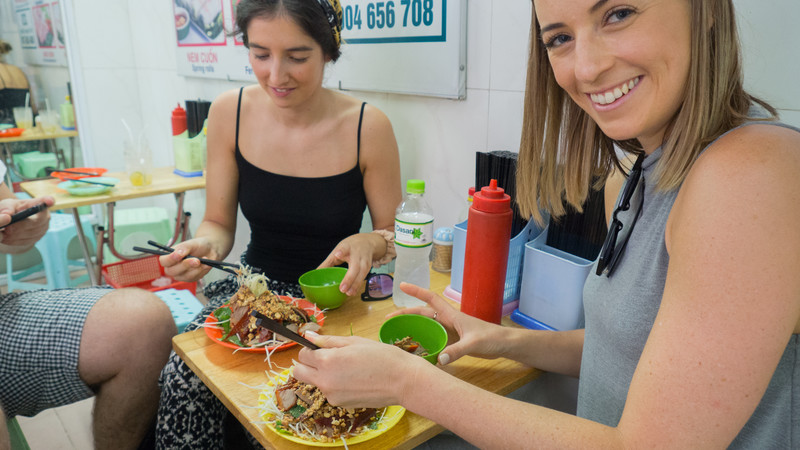 Two travellers enjoy lunch in Hanoi