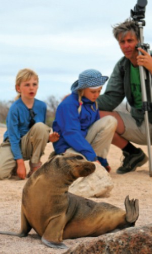 Family watches seal in the Galapagos