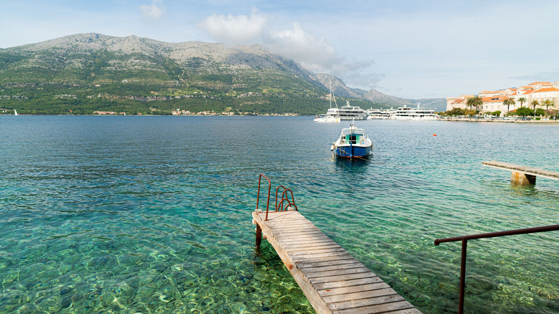 Korčula coast with jetty and mountain in background
