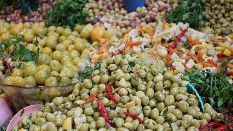 A pile of different coloured olives
