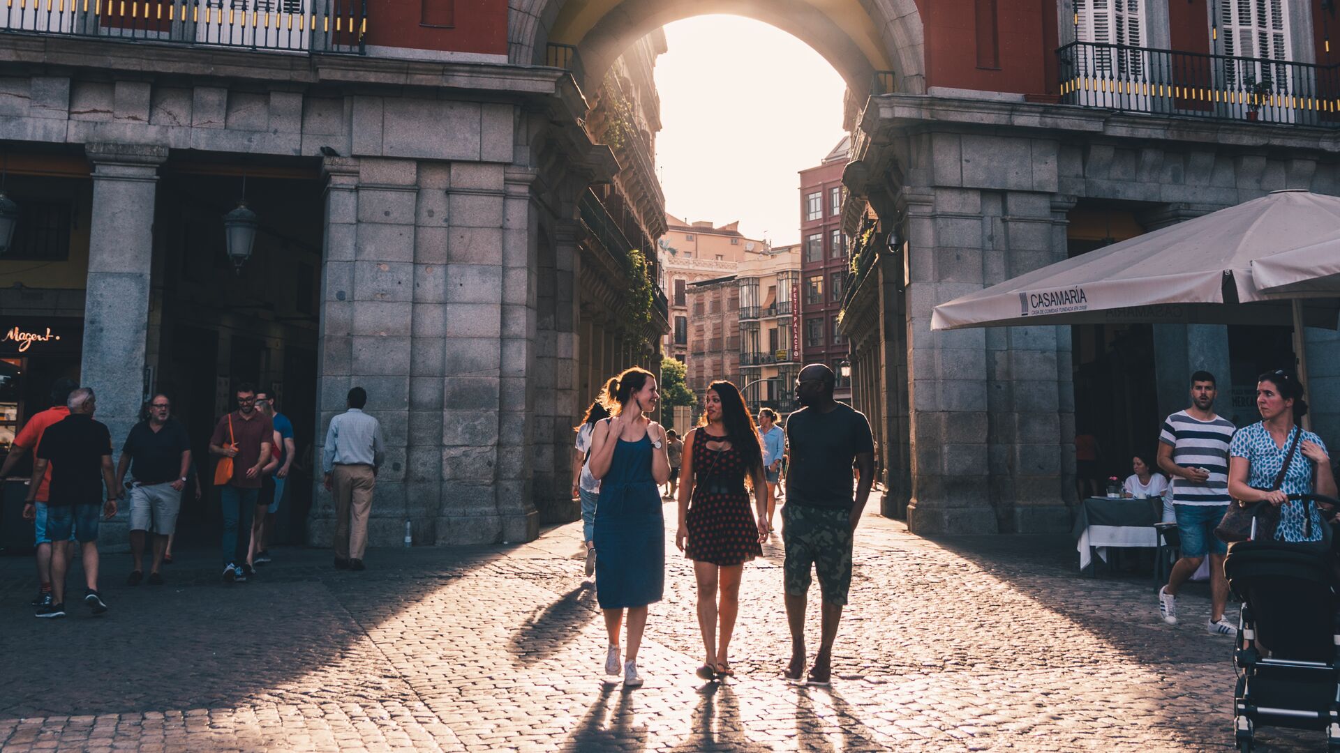 A group of travellers exploring the plazas of Madrid, Spain.
