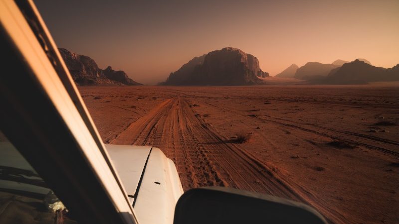 The front of a car driving through the desert