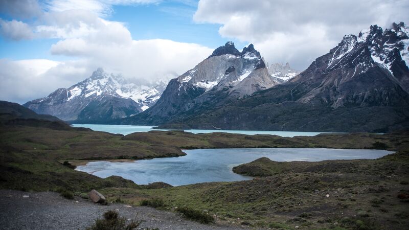 A lake and some snow-covered mountains