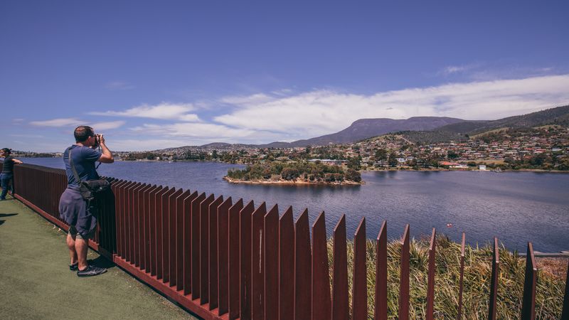 A woman looks out over the bay in Tasmania
