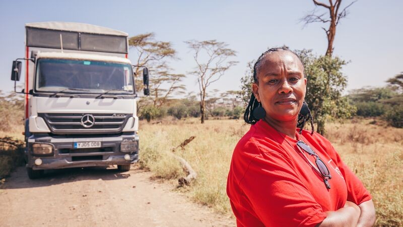 Becky standing in front of her truck