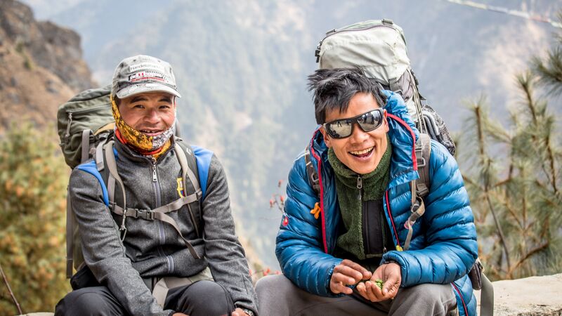 Two smiling porters in Nepal