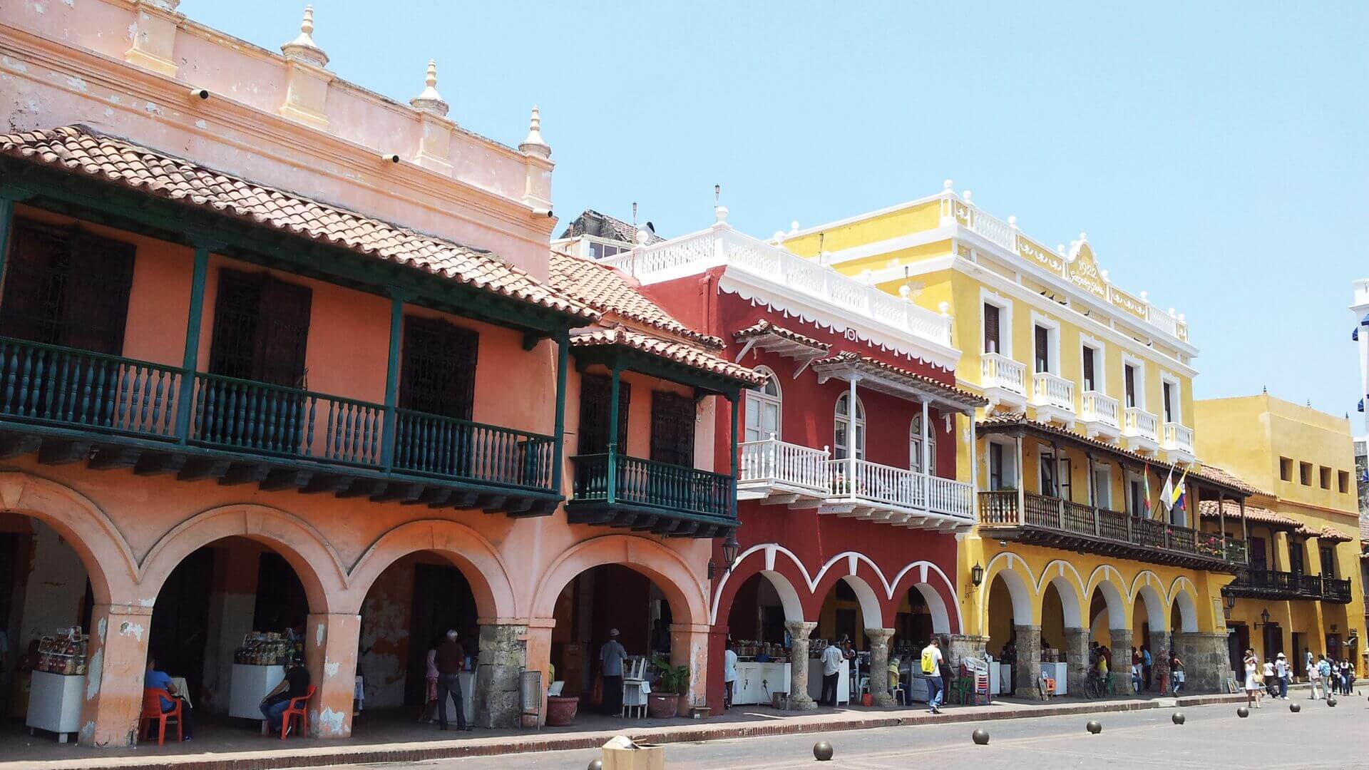 The bright coloured buildings of Cartagena Town Square, Colombia