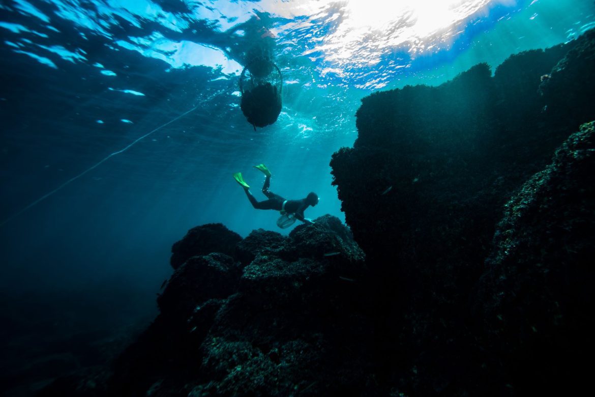 a haenyeo diving into the water