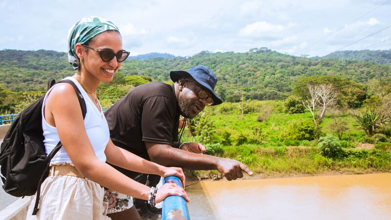 Two travellers spotting crocodiles in a river in Costa Rica.