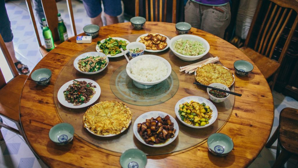 A spread of traditional Chinese dishes on a lazy susan