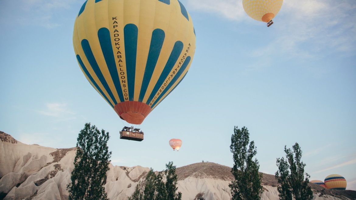 Multicoloured hot air balloons floating over the city of Cappadocia in Turkey.