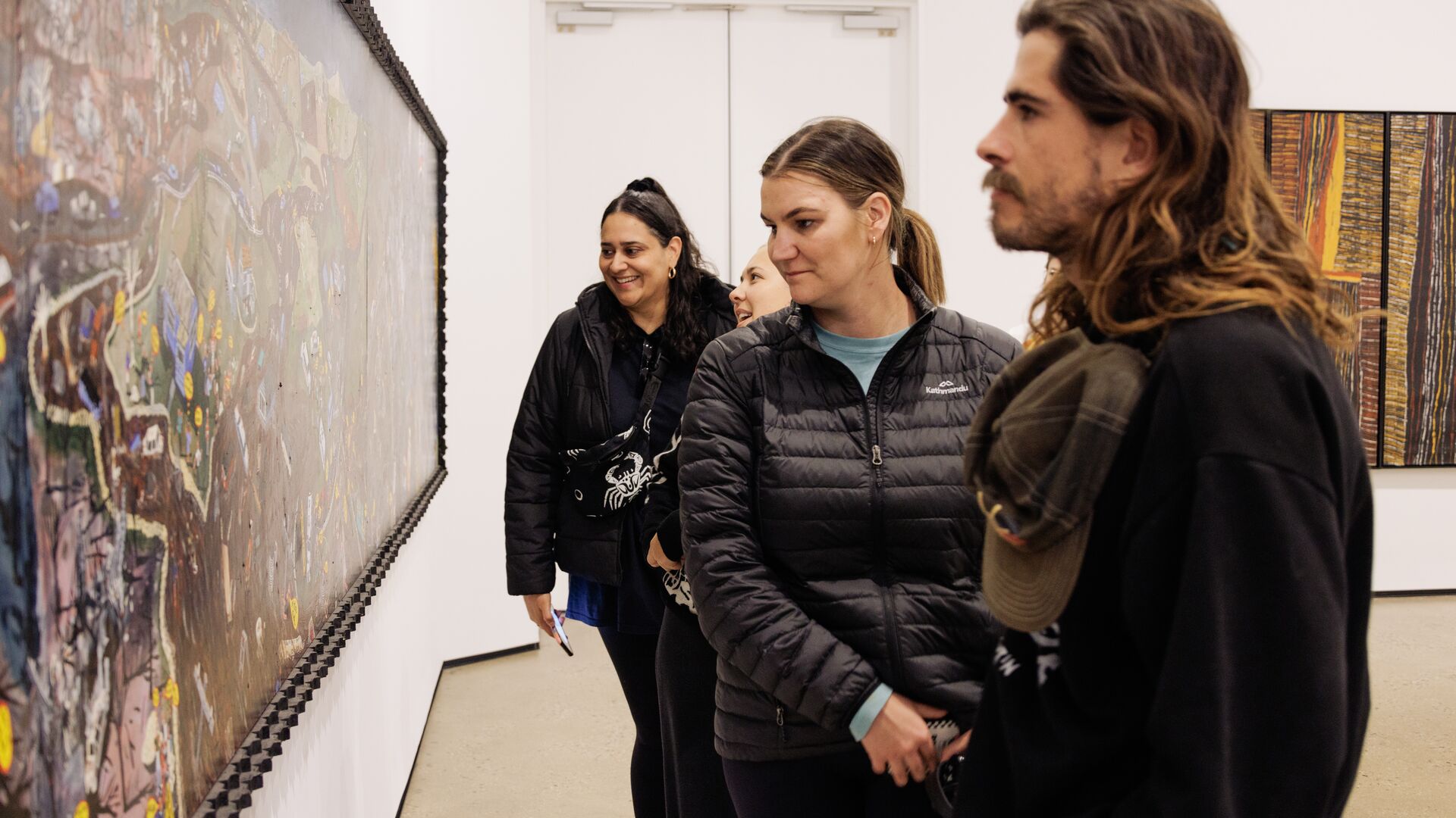An Intrepid group looking at a painting in Victoria, Australia. 