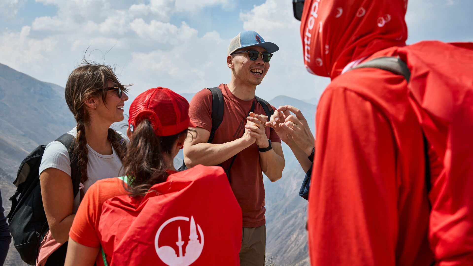 Intrepid travellers and their leaders smiling and chatting on the Quarry Trail.