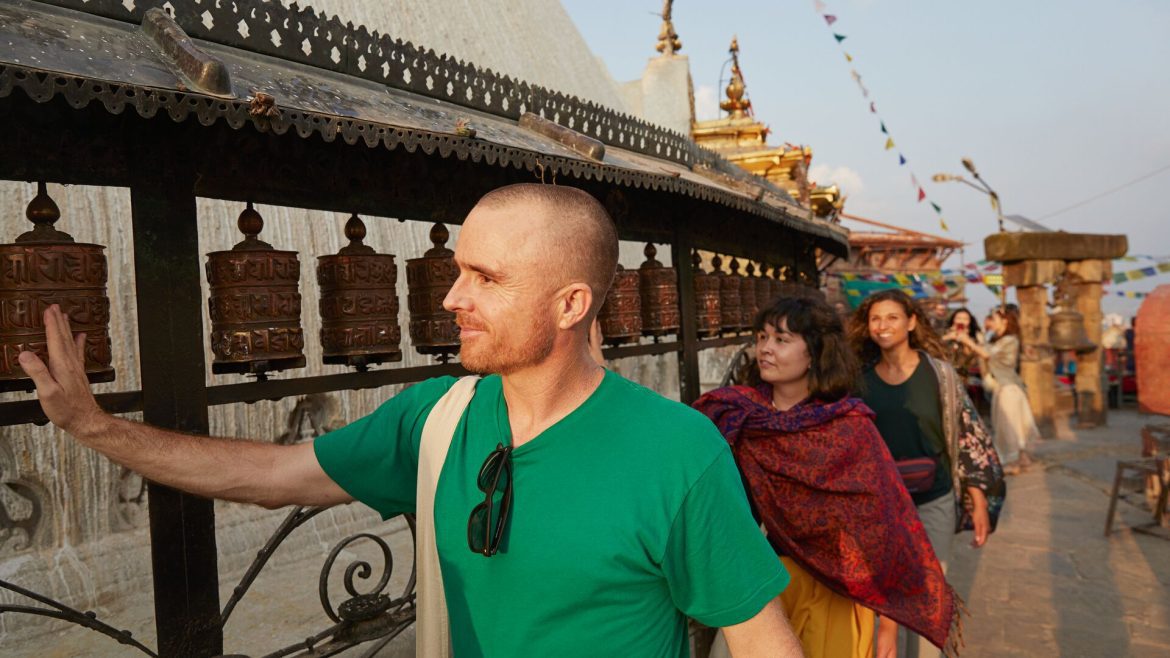 A group of travellers at a stupa in Nepal