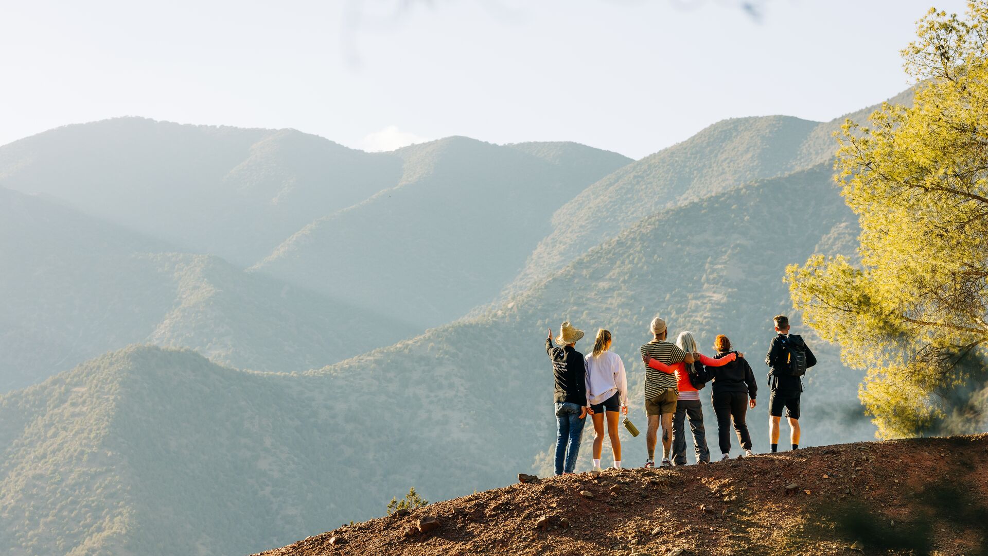 A group of travellers admire the mountain view in Morocco