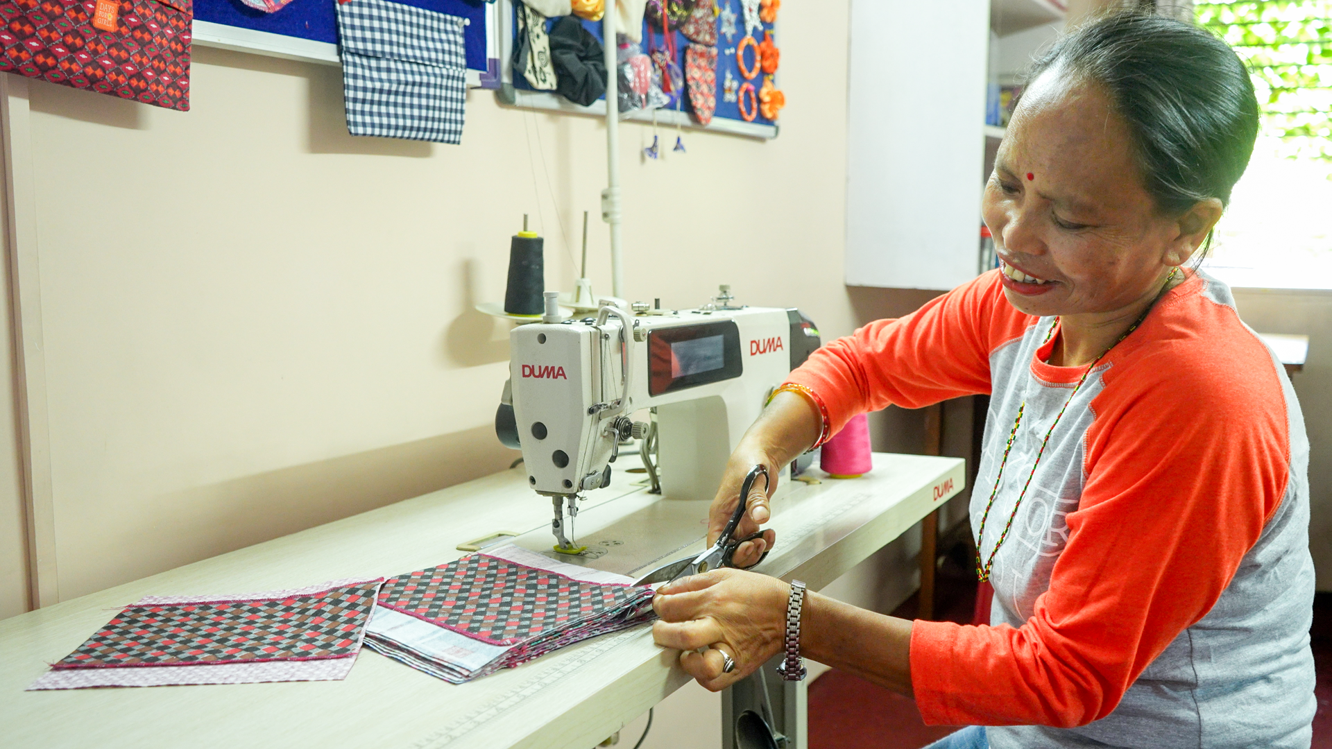 Days for Girls staff makes a reusable sanitary pad in Nepal