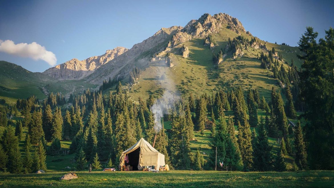 A yurt at the foot of a mountain in Kyrgyzstan's Tien Shan Mountain Range. Photo by Liz Carlson.
