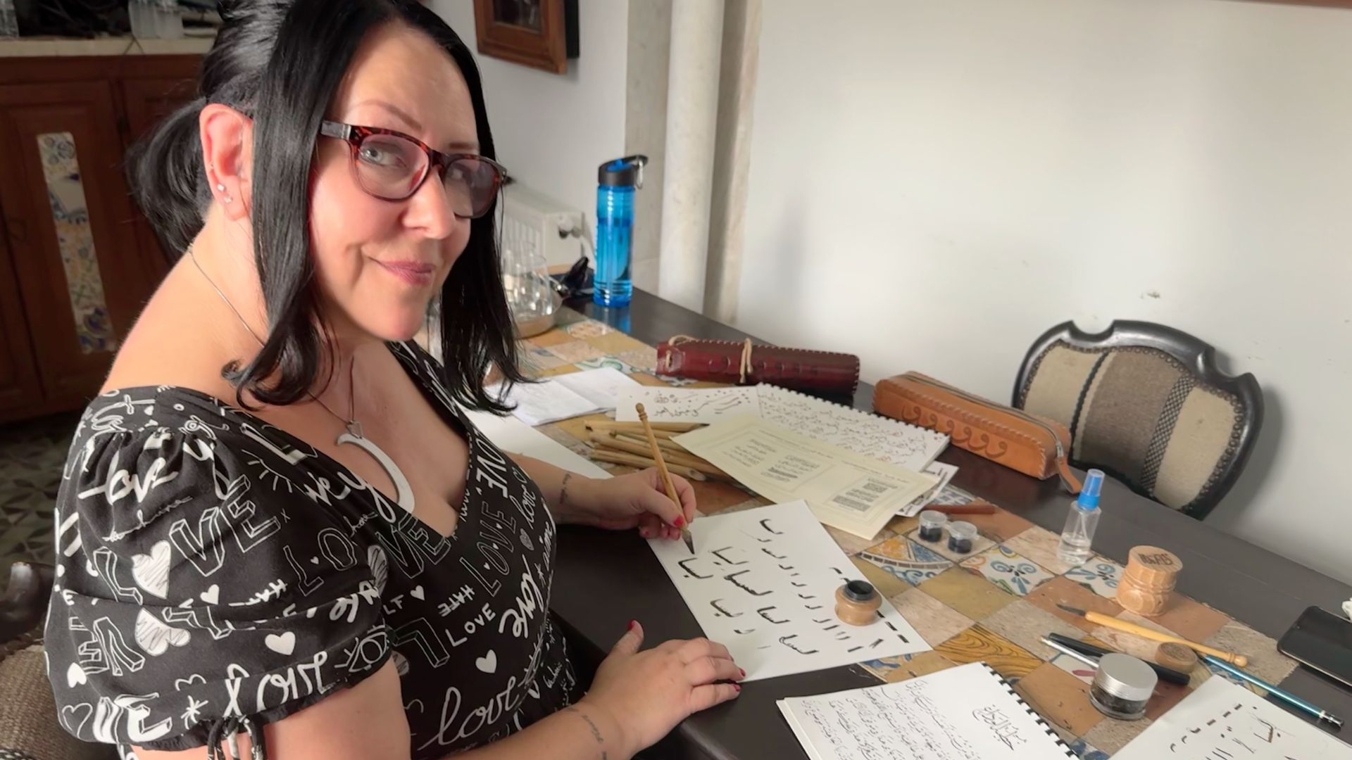 Writer Liisa Ladouceur in Intrepid's new calligraphy class. 