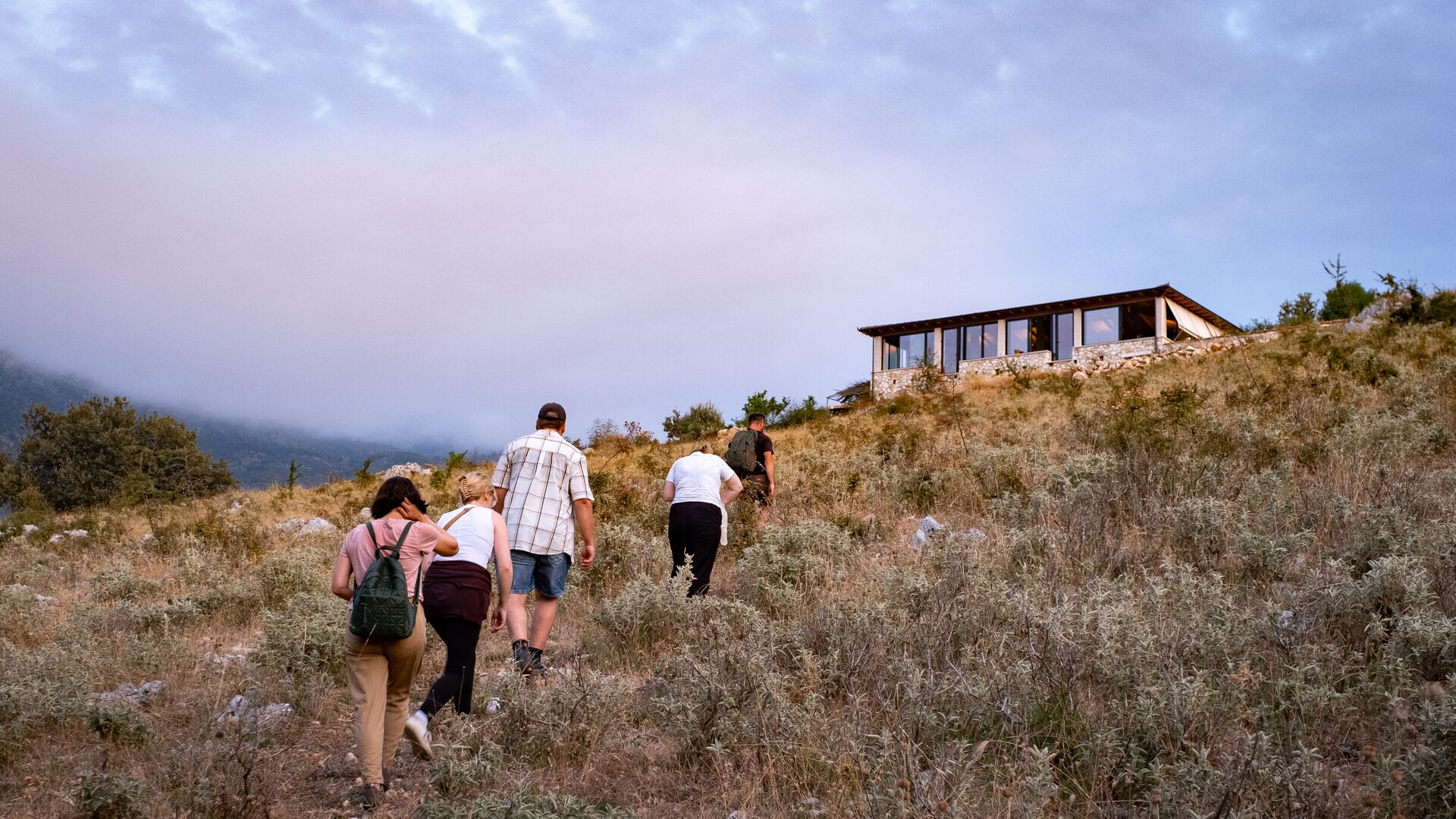 Hikers in Albania head towards a resting place