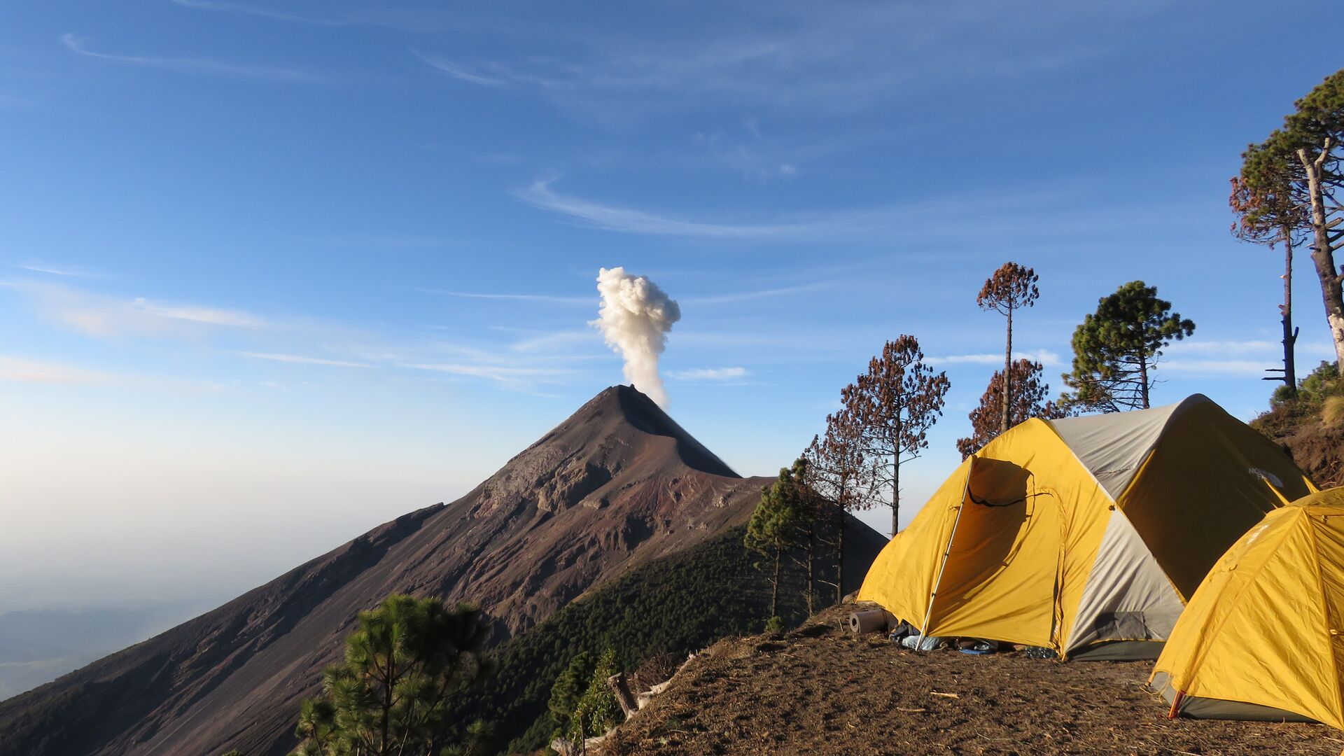 Views of steaming Fuego volcano from Acatenango base camp