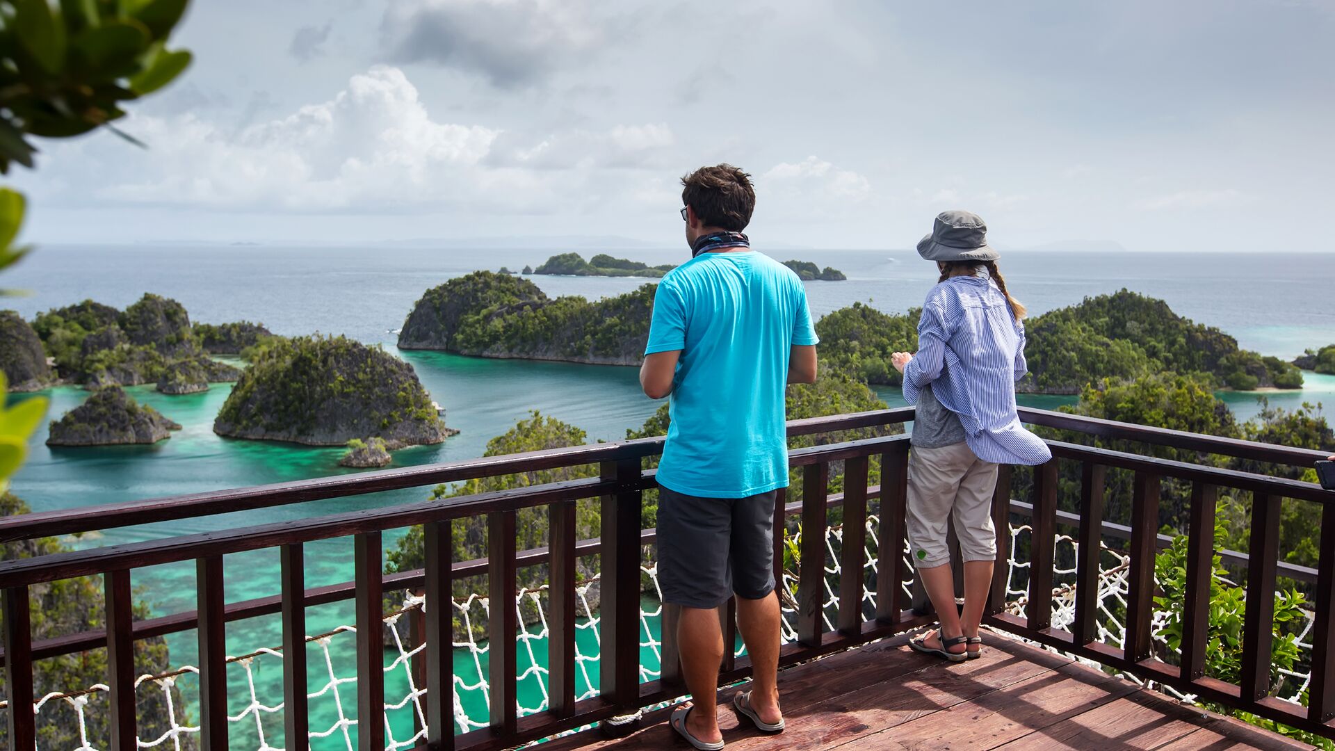 Travellers admiring Raja Ampat from a scenic viewpoint