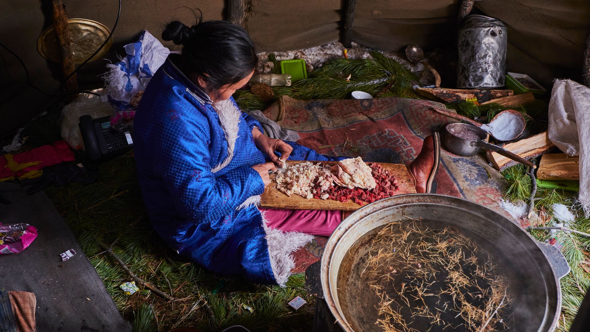 A local Tsaatan women performing daily chores.