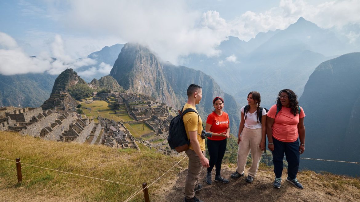 A group of Intrepid Travellers overlook Machu Picchu in Peru
