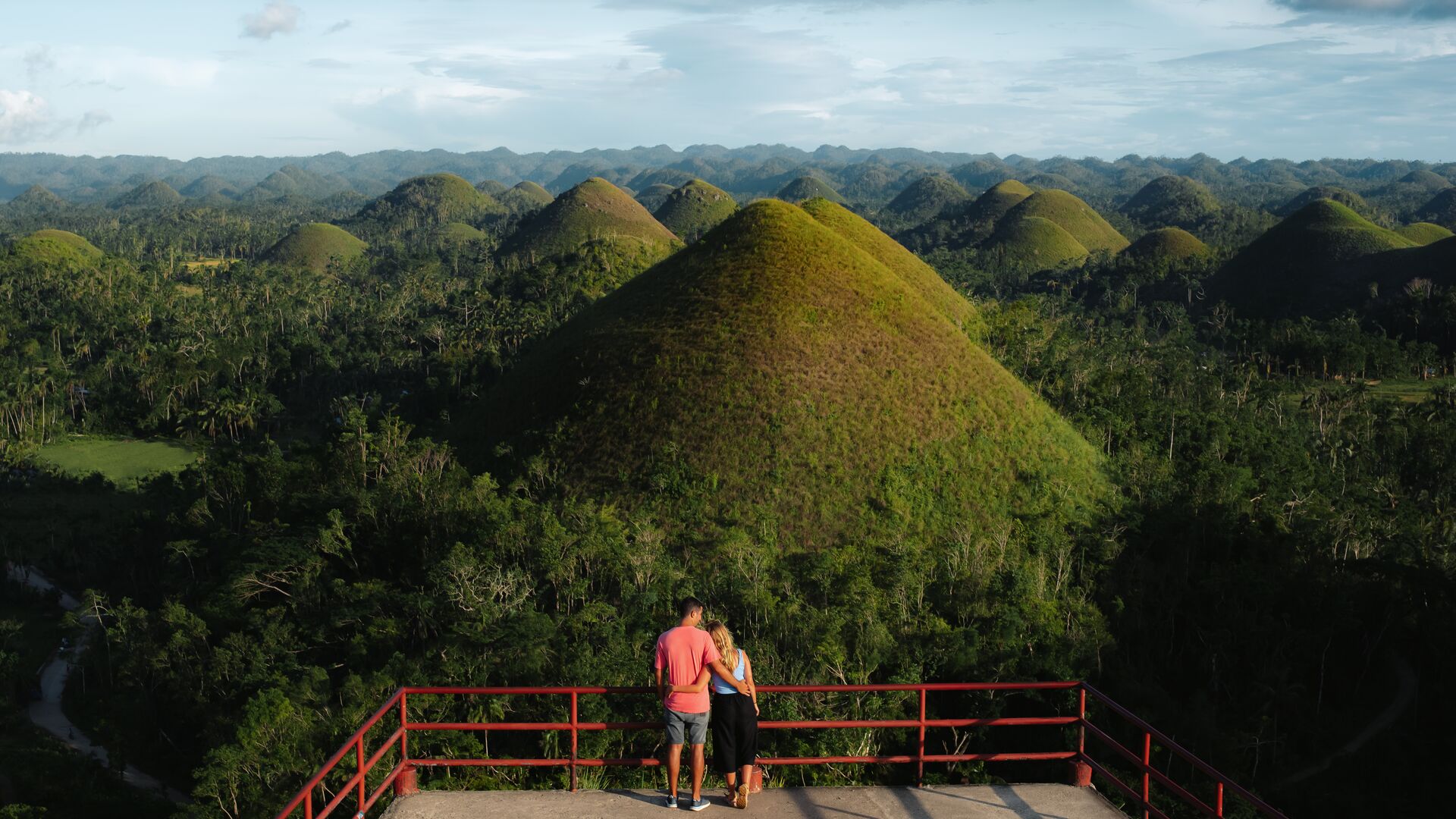A couple in the Philippines looking over the Chocolate HIlls