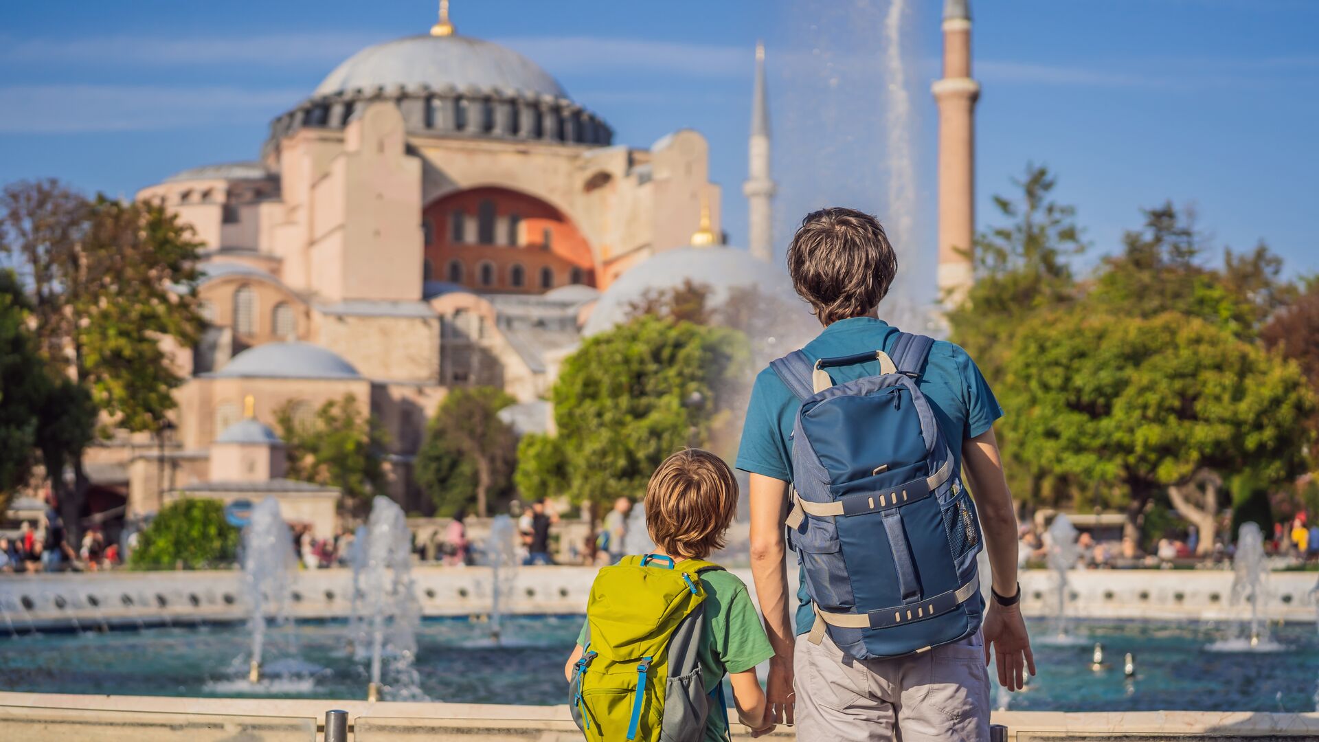A parent and child admire the Hagia Sofia in Istanbul