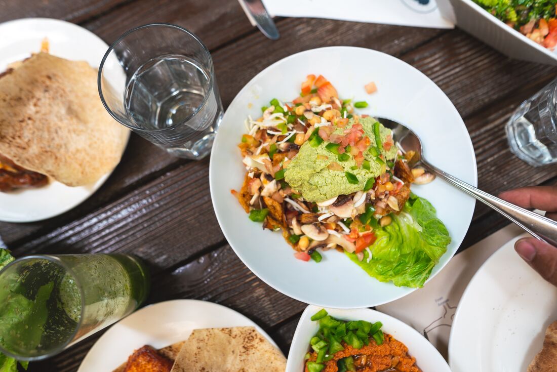Bean dish and flat bread on wooden table