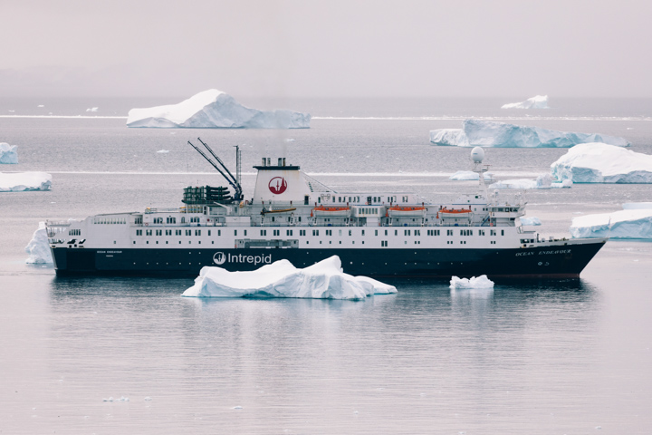 Ocean Endeavour anchored in Antarctic waters surrounded by icebergs