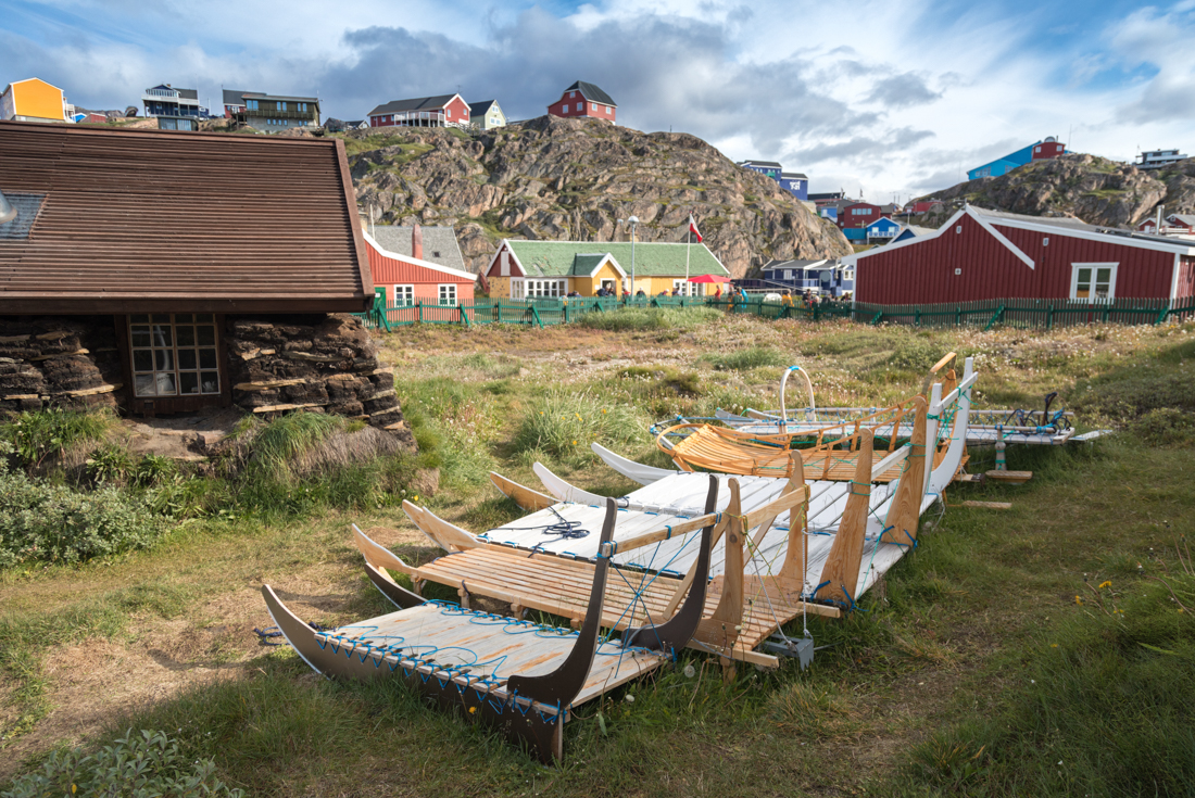 Varietal toboggans rest in springtime in the village of Sisimiut western Greenland