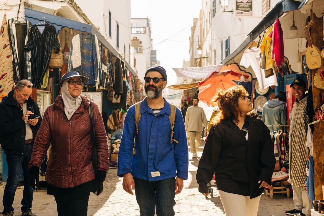 Intrepid travellers with a local guide on a tour of Essaouira