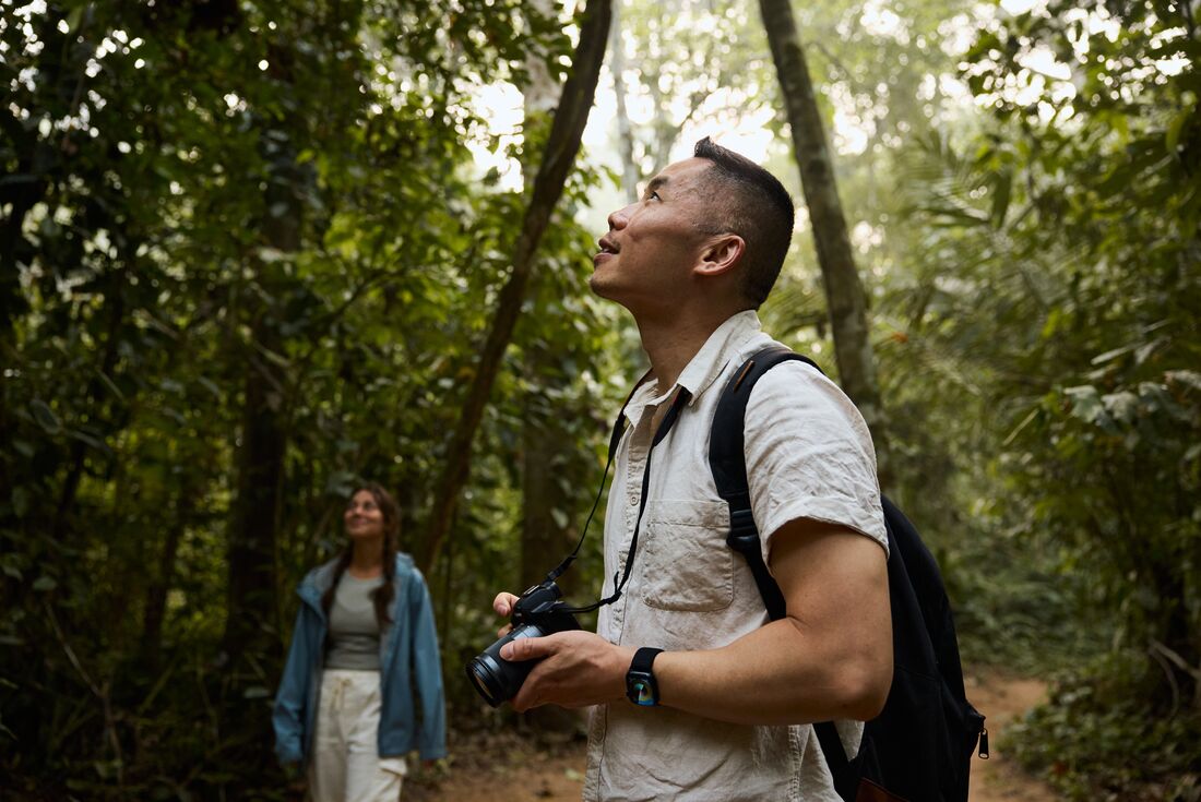 Intrepid traveller father and daughter in the depths of the Amazon Rainforest in Peru