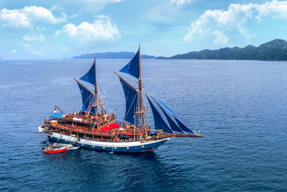 Aerial view of a sailboat near Raja Ampat islands, Indonesia