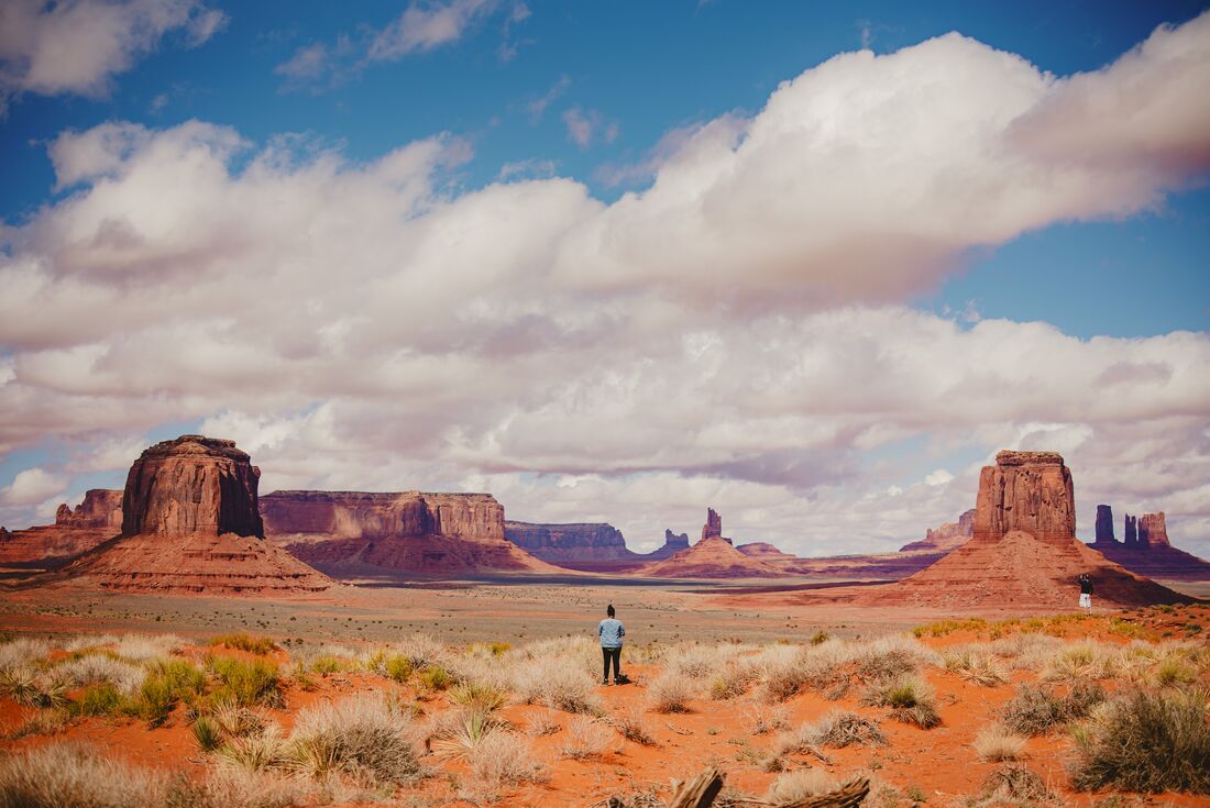 Traveller standing and marvelling at Monument Valley in Utah USA