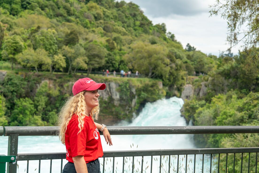 Smiling Leader standing at the rails at Huka Falls, New Zealand