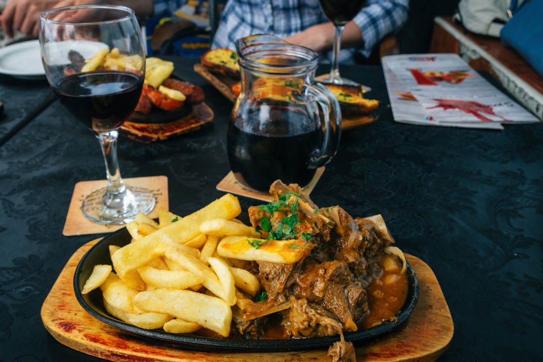 Braised goat with table temperanillo in a local guachinche on Tenerife in the Canary Islands of Spain