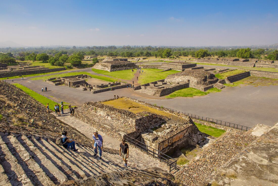 Looking out over spread of ancient city of Teotihuacan in Mexico from top of stone ziggurat