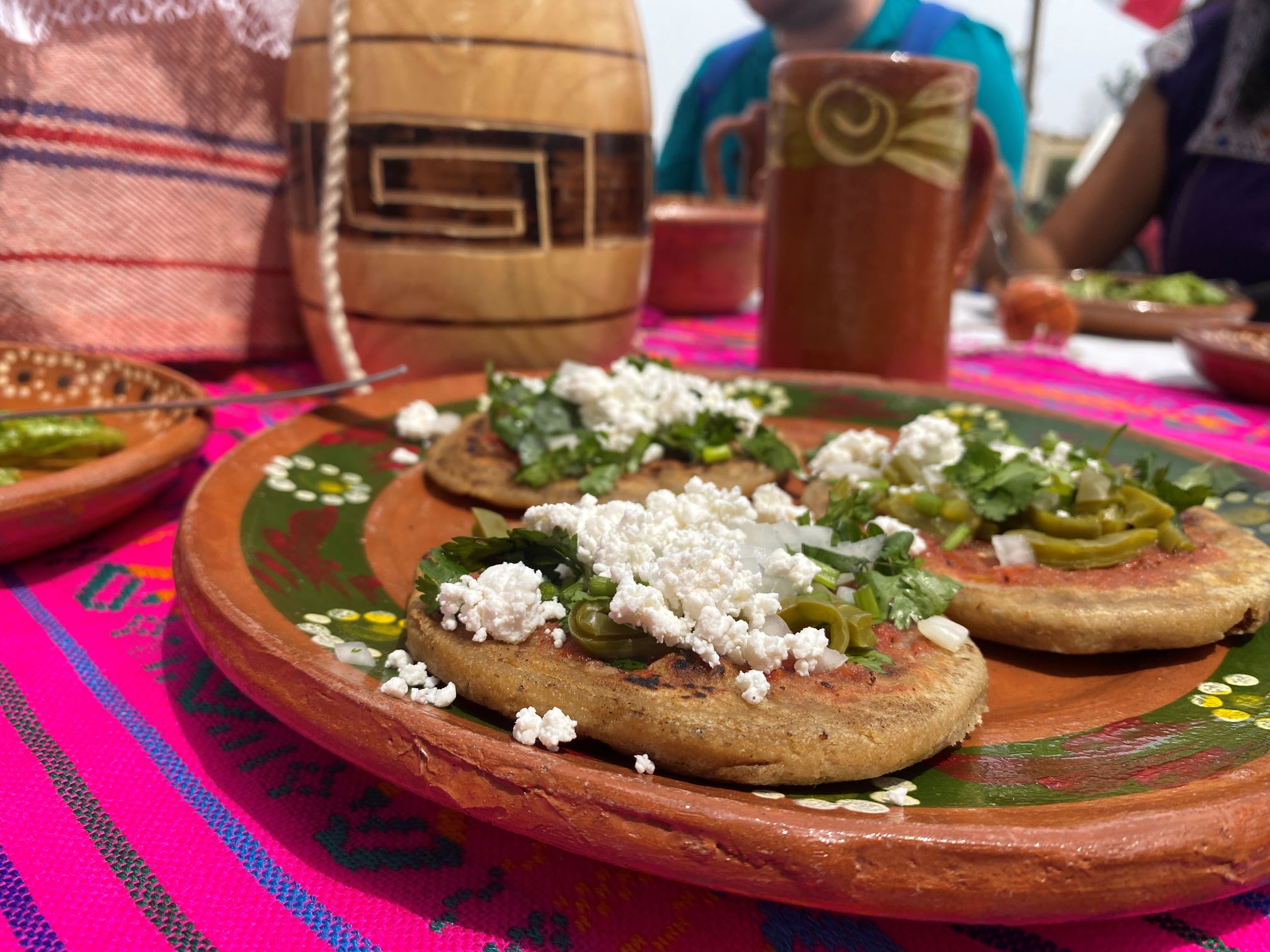 Lunch in Tlahuac of stuffed tortillas with nopales and cotija cheese