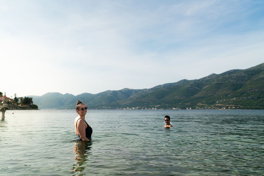 Intrepid travellers go for a swim off the coast of Elafiti Island in Croatia