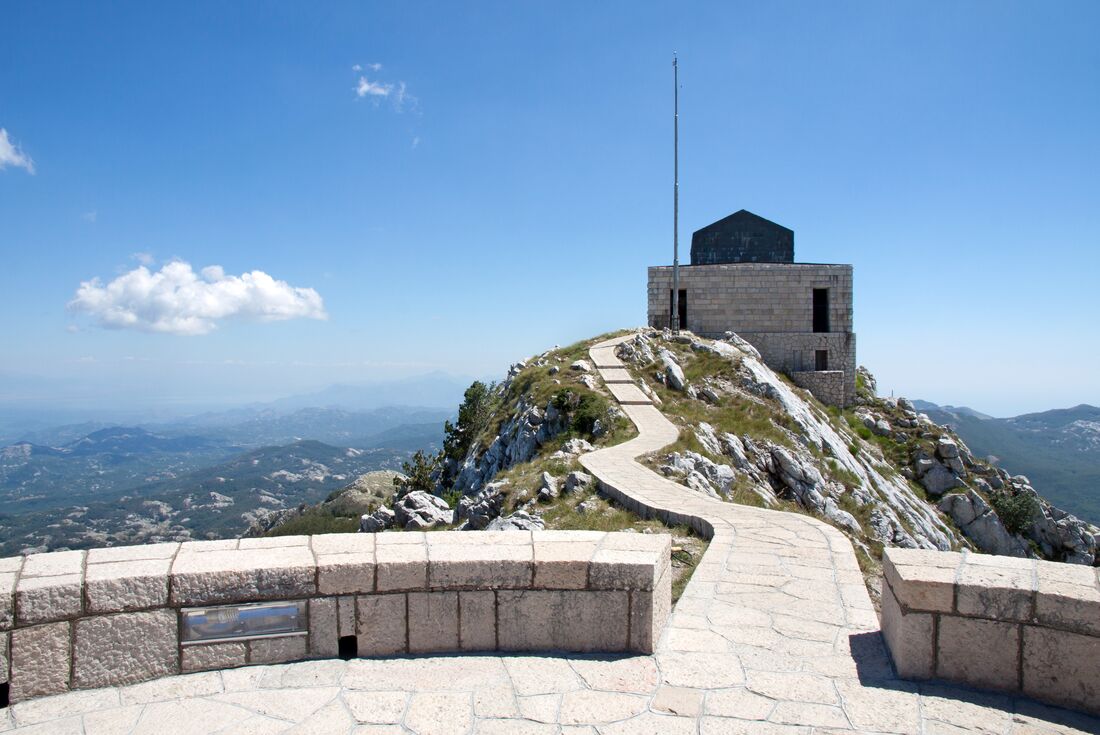 Stone path leading up to the Njegos Mausoleum in Cetinje, Montenegro on a clear blue day