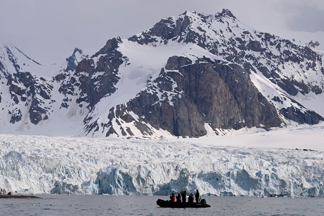 Experience the quiet majesty of glacial fjords and towering mountains in Svalbard