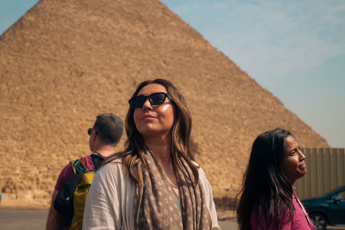 Travellers in front of a Pyramid in Giza, Cairo, Egypt