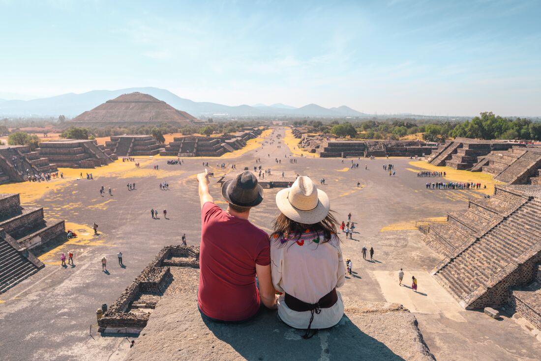 Travellers marvelling atop Teotihuacan in Mexico